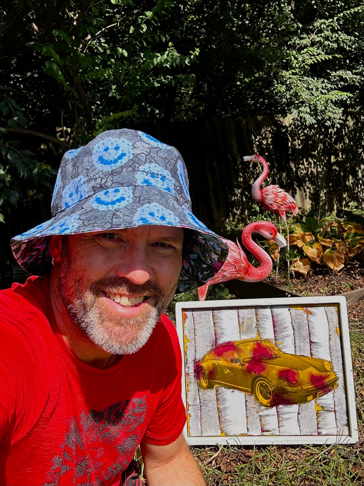 smiley blue flowers on grey clouds / paypaya leaves and magenta flowers with some blue Reversible bucket hat